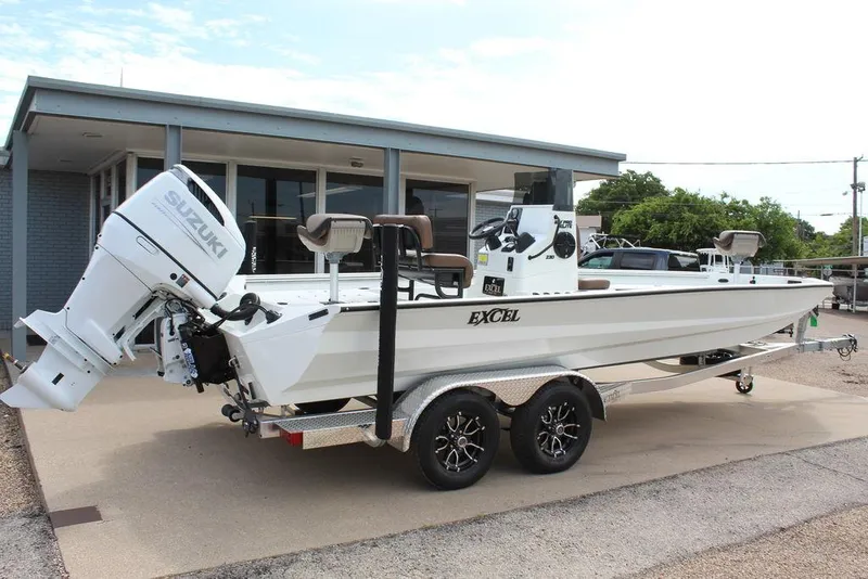 Slide: The Image of 2026 Excel Bay Pro Elite 230 boat with Suzuki engine on a trailer. - 3