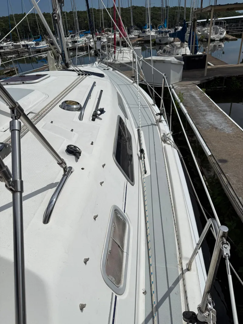 Slide: The Image of Sailboat deck view of 2005 Hunter 33 in marina setting. - 5