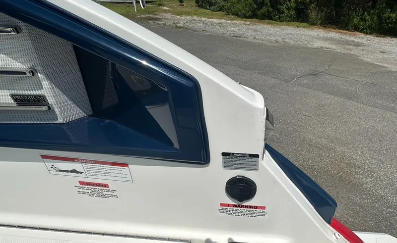 Slide: The Image of 2022 Cobalt A29 boat detail with warning labels and premium audio system. - 10