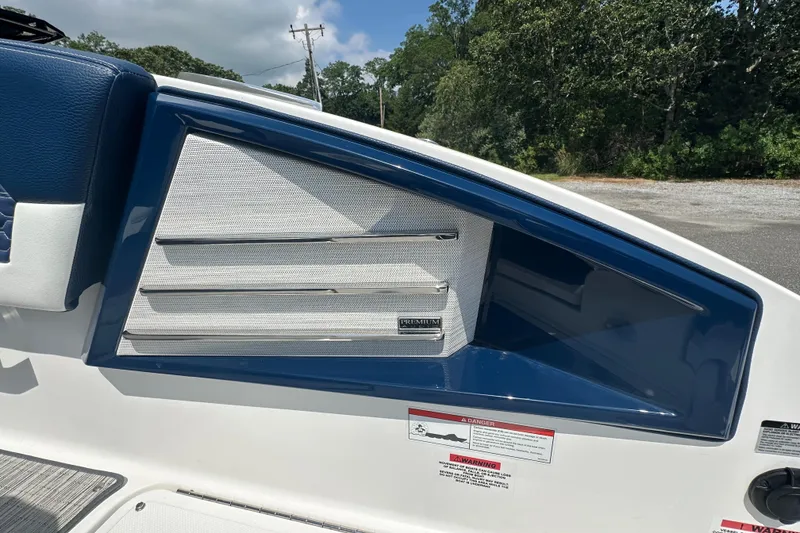 Slide: The Image of 2022 Cobalt A29 boat interior detail with blue and white upholstery. - 11