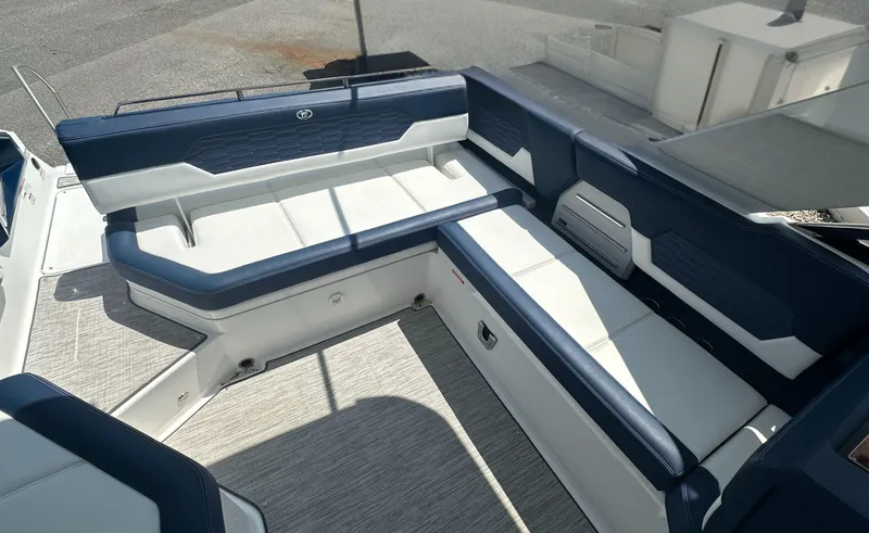 Slide: The Image of 2022 Cobalt A29 boat interior with blue and white seating arrangement. - 13