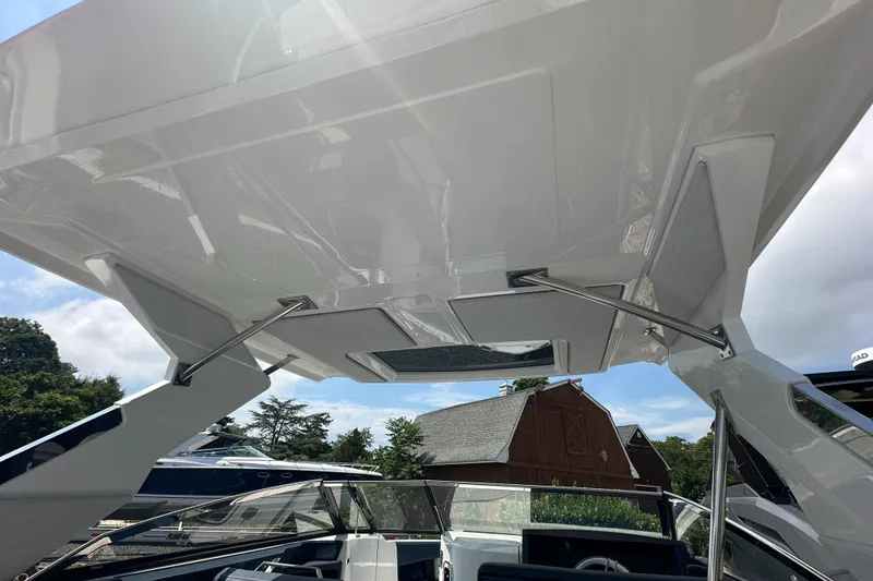 Slide: The Image of 2022 Cobalt A29 boat with sleek design and modern canopy structure. - 17