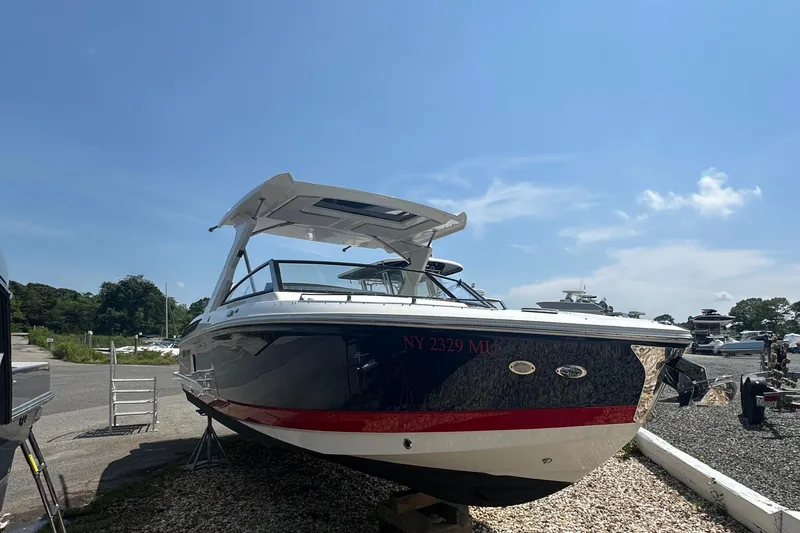 Slide: The Image of 2022 Cobalt A29 boat on display under a clear blue sky. - 3