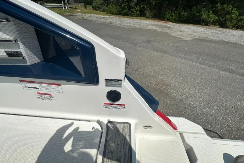 Slide: The Image of 2022 Cobalt A29 boat deck with warning labels and premium audio system. - 8