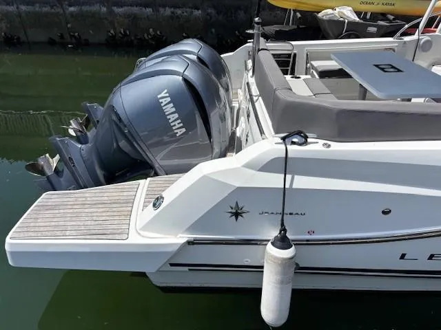 Slide: The Image of 2023 Jeanneau Leader 9.0 WA boat with Yamaha engines docked in marina. - 15