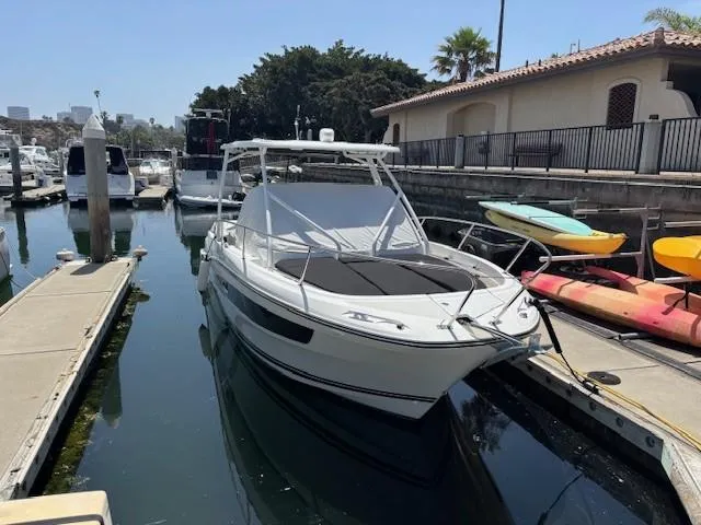Slide: The Image of 2023 Jeanneau Leader 9.0 WA boat docked at marina, sunny day. - 3