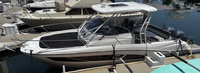 Slide: The Image of 2023 Jeanneau Leader 9.0 WA boat docked at marina, side view. - 32