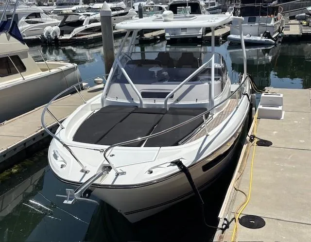 Slide: The Image of 2023 Jeanneau Leader 9.0 WA boat docked at marina, featuring sleek design and modern amenities. - 34
