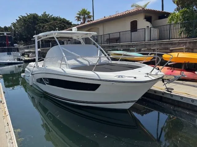 Slide: The Image of 2023 Jeanneau Leader 9.0 WA boat docked in a marina, sunny day. - 7