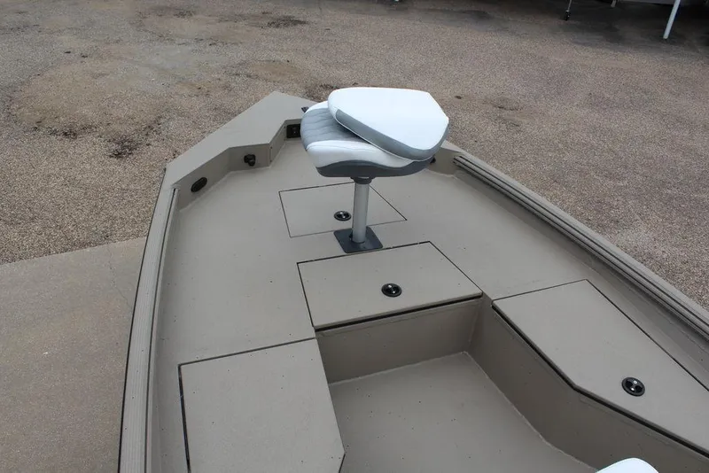 Slide: The Image of 2026 Excel Bay Pro Elite 203 boat interior with swivel seat and storage compartments. - 10