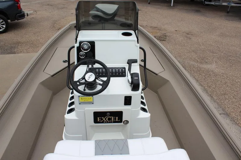 Slide: The Image of 2026 Excel Bay Pro Elite 203 boat console with steering wheel and controls. - 11