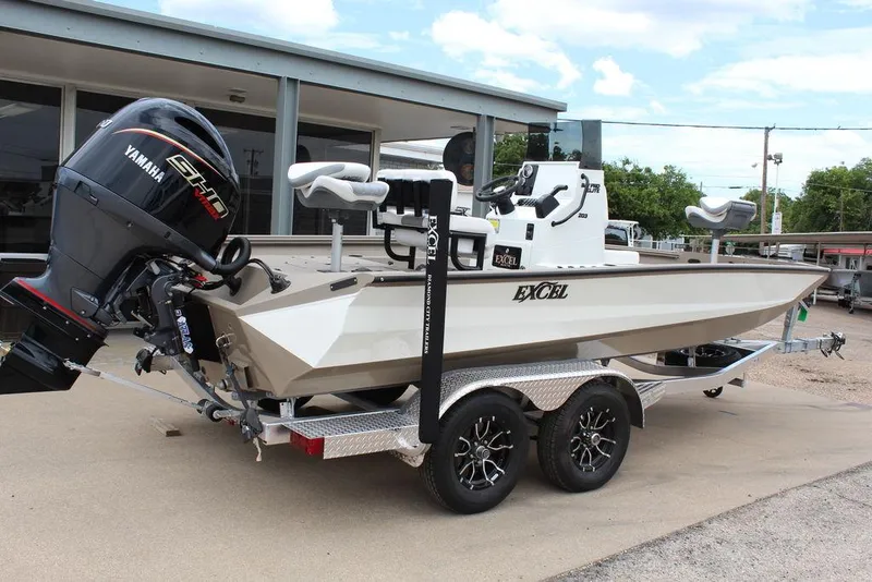 Slide: The Image of 2026 Excel Bay Pro Elite 203 boat with Yamaha engine on a trailer. - 2