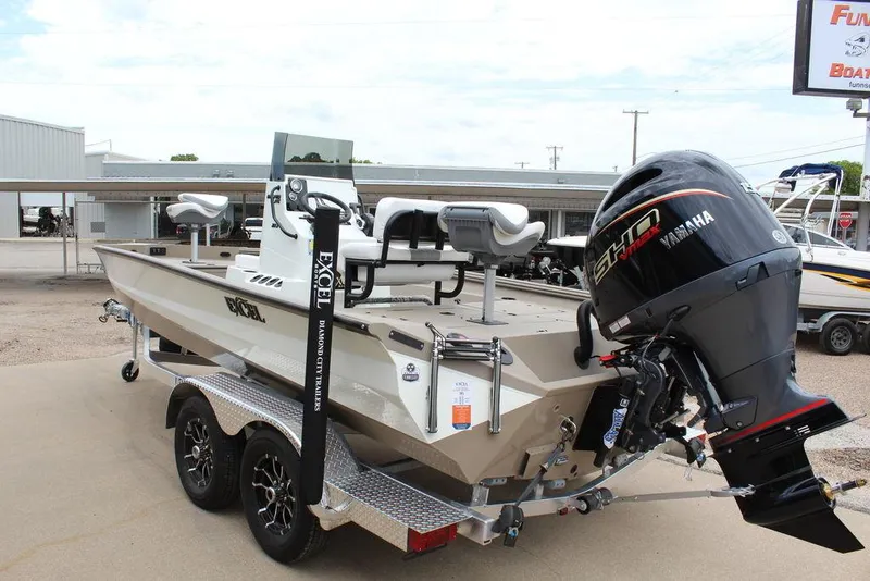 Slide: The Image of 2026 Excel Bay Pro Elite 203 boat with Yamaha outboard motor on trailer. - 3
