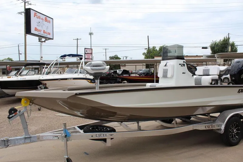 Slide: The Image of 2026 Excel Bay Pro Elite 203 boat on trailer at dealership. - 6