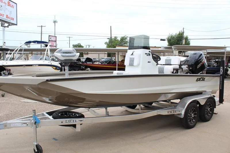 Slide: The Image of 2026 Excel Bay Pro Elite 203 boat on trailer, displayed at dealership. - 7
