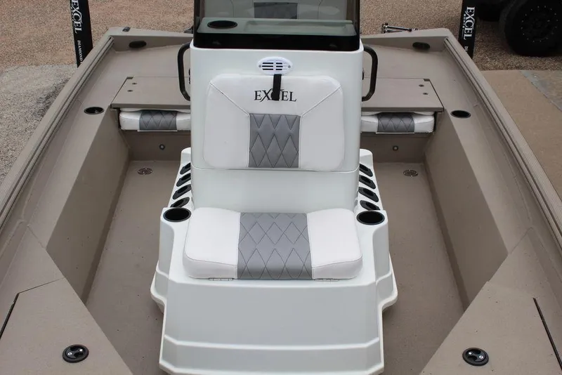 Slide: The Image of 2026 Excel Bay Pro Elite 203 boat interior with cushioned seating and cup holders. - 8