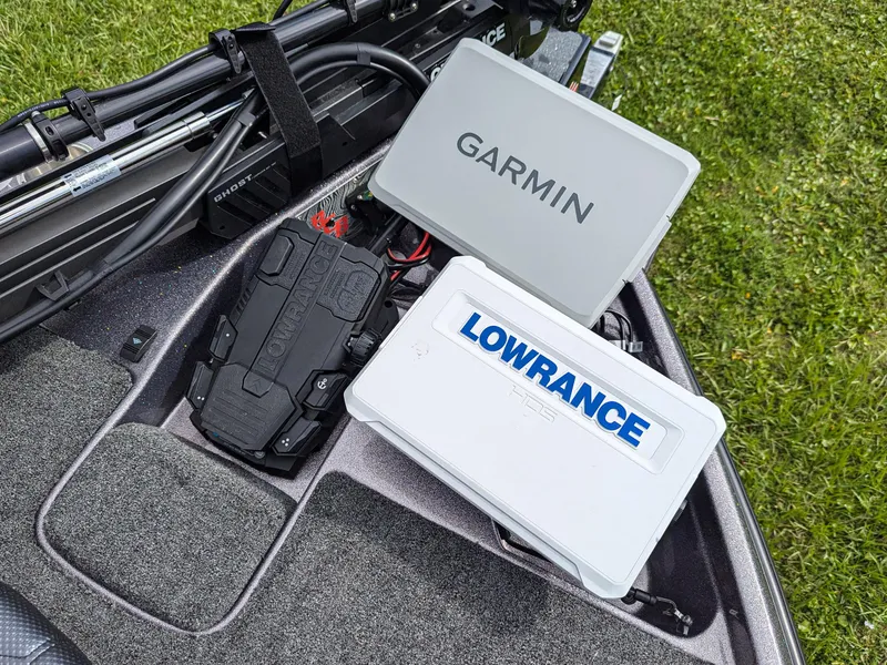 Slide: The Image of Bass Cat Lynx STS 2026 boat with Garmin and Lowrance electronics on deck. - 12