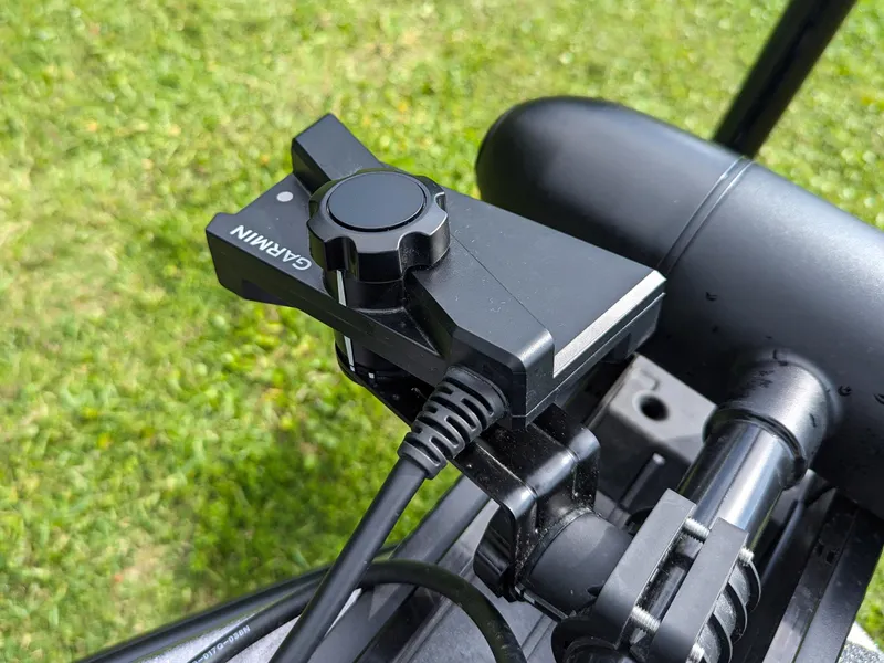 Slide: The Image of Garmin device mounted on 2026 Bass Cat Lynx STS boat, grassy background. - 13