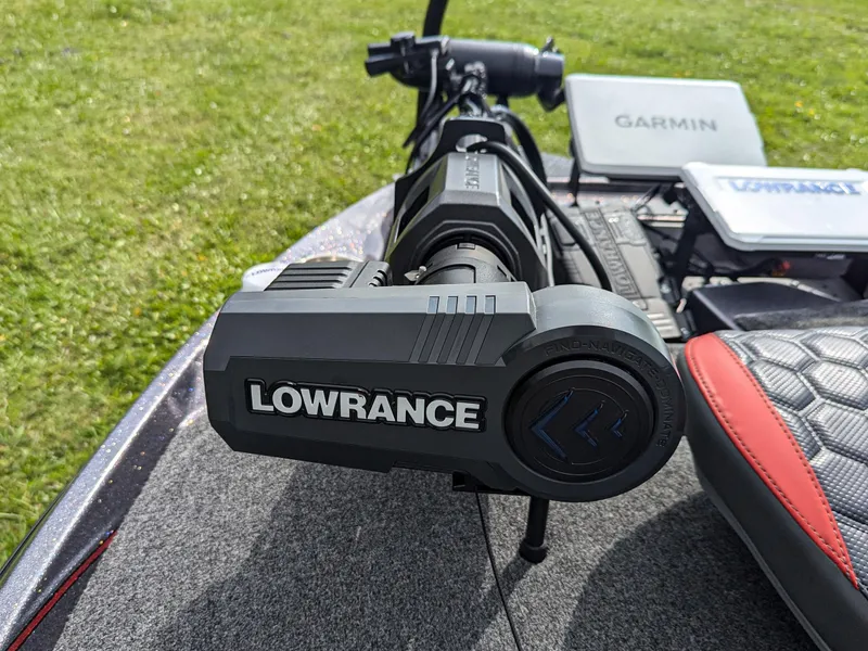 Slide: The Image of 2026 Bass Cat Lynx STS boat with Lowrance and Garmin equipment on deck. - 14
