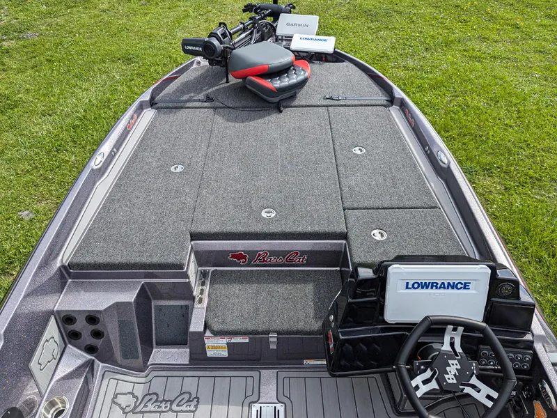 Slide: The Image of 2026 Bass Cat Lynx STS fishing boat with Lowrance electronics and Garmin equipment on deck. - 7