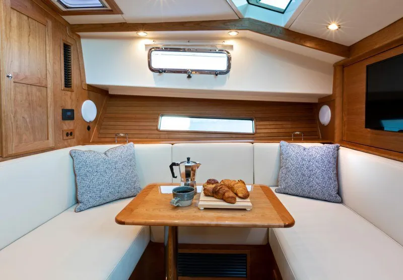 Slide: The Image of Luxurious interior of 2026 Sabre 43 Salon Express yacht with cozy seating and breakfast setup. - 22