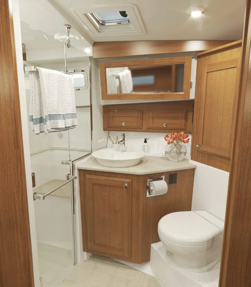 Slide: The Image of Luxurious bathroom in 2026 Sabre 43 Salon Express yacht with wood cabinetry and modern fixtures. - 32
