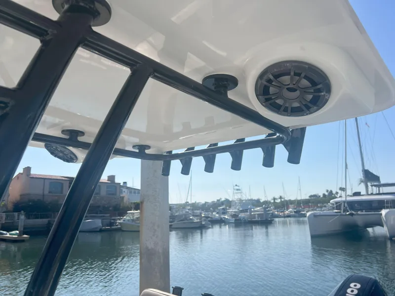 Slide: The Image of Boat canopy with speaker, Reflex Gladiator 2400, docked in marina, 2026 model. - 25