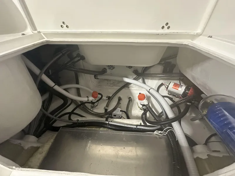 Slide: The Image of Interior view of Reflex Gladiator 2400 boat, showcasing wiring and plumbing, 2026 model. - 32