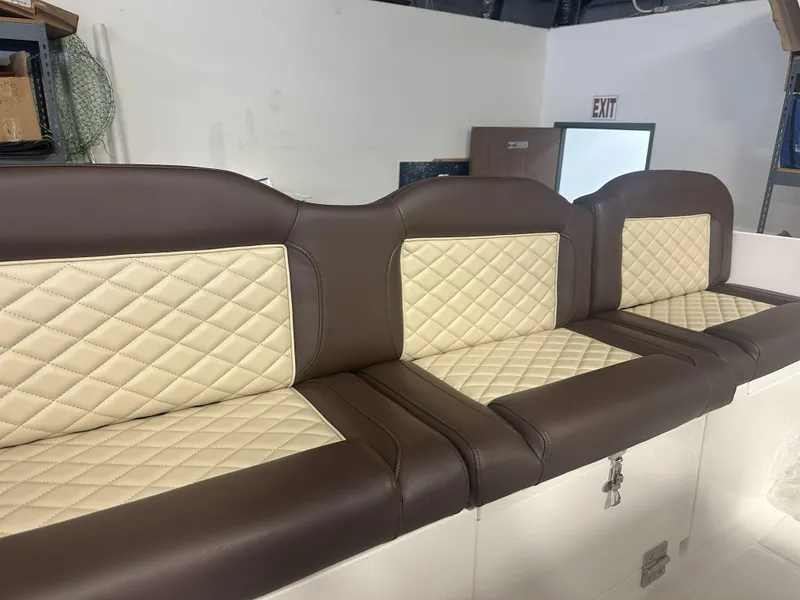 Slide: The Image of Brown and cream quilted boat seats in a 2026 Reflex Gladiator 2400. - 40