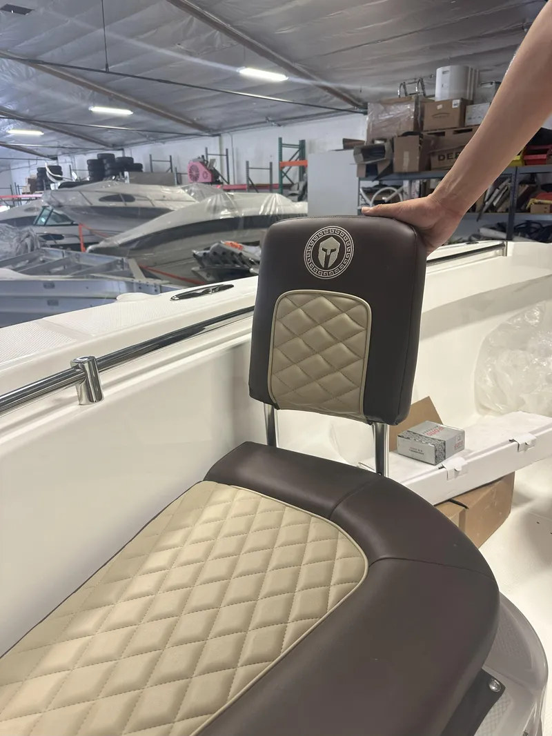 Slide: The Image of Luxurious boat seat in a Reflex Gladiator 2400, 2026 model, inside a storage facility. - 41