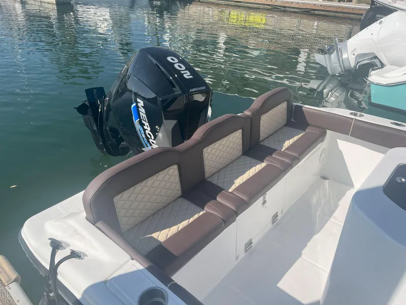 Slide: The Image of Luxury seating on a 2026 Reflex Gladiator 2400 boat with powerful Mercury outboard engine. - 5