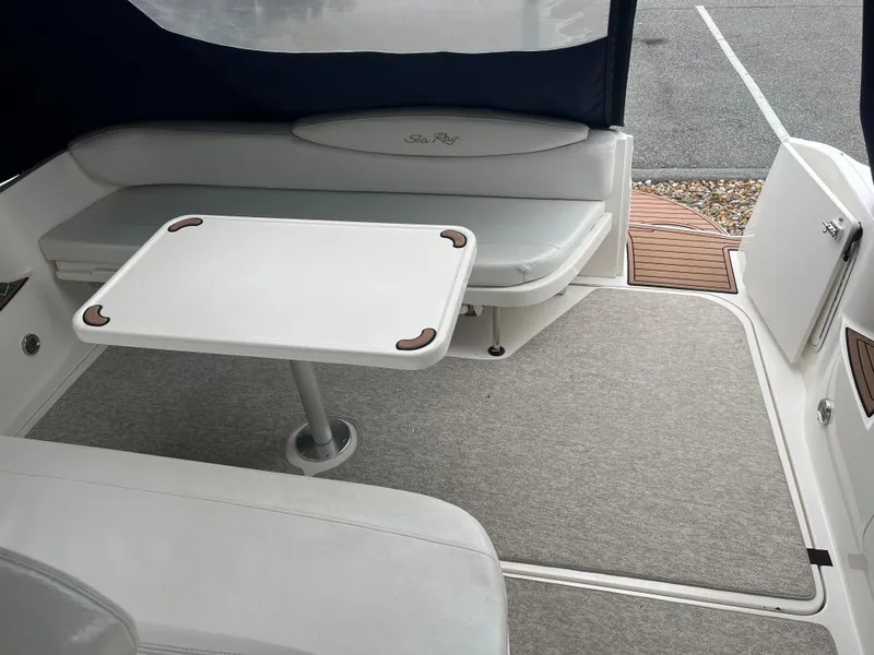 Slide: The Image of Interior of 2000 Sea Ray 340 Sundancer with seating and table setup. - 16