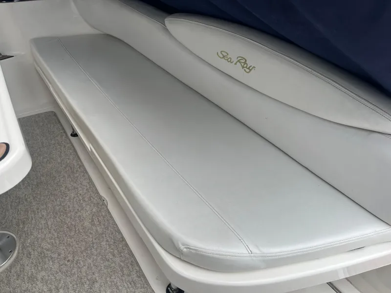 Slide: The Image of White leather seating on a 2000 Sea Ray 340 Sundancer boat. - 18