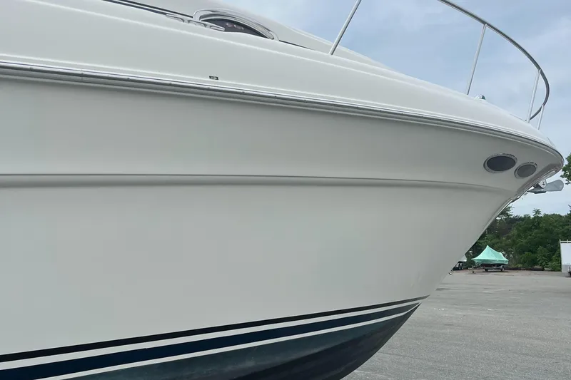 Slide: The Image of 2000 Sea Ray 340 Sundancer boat, white hull, docked outdoors. - 34