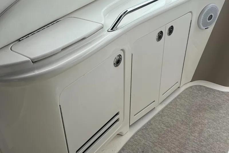 Slide: The Image of Interior view of a 2000 Sea Ray 340 Sundancer boat with storage cabinets. - 36