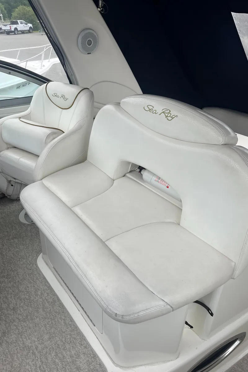 Slide: The Image of White leather seating on a 2000 Sea Ray 340 Sundancer boat interior. - 37