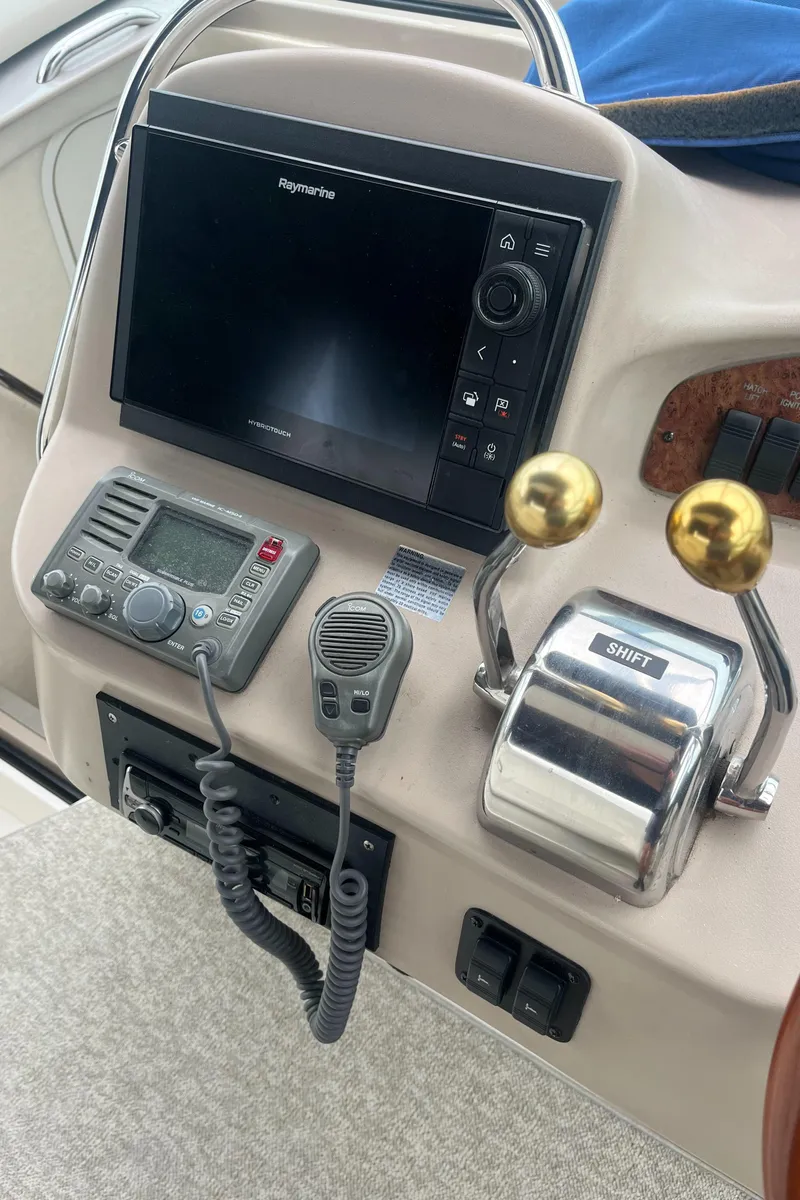 Slide: The Image of Control panel of a 2000 Sea Ray 340 Sundancer boat with navigation equipment. - 39