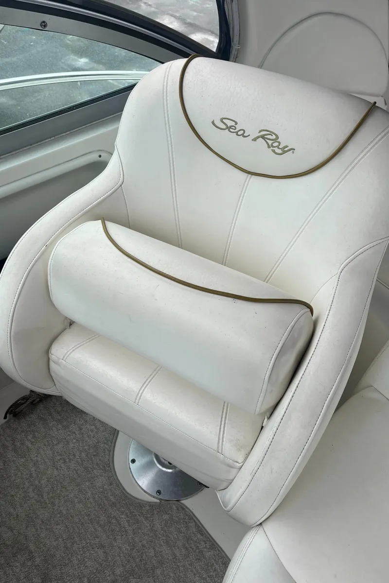 Slide: The Image of White captain's chair on 2000 Sea Ray 340 Sundancer boat, featuring embroidered logo. - 41