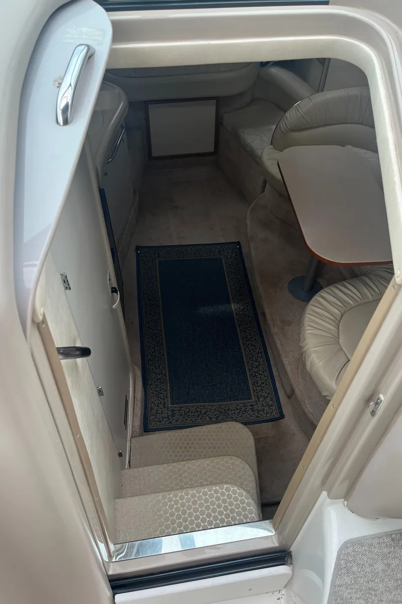 Slide: The Image of Interior view of a 2000 Sea Ray 340 Sundancer cabin with seating and table. - 42