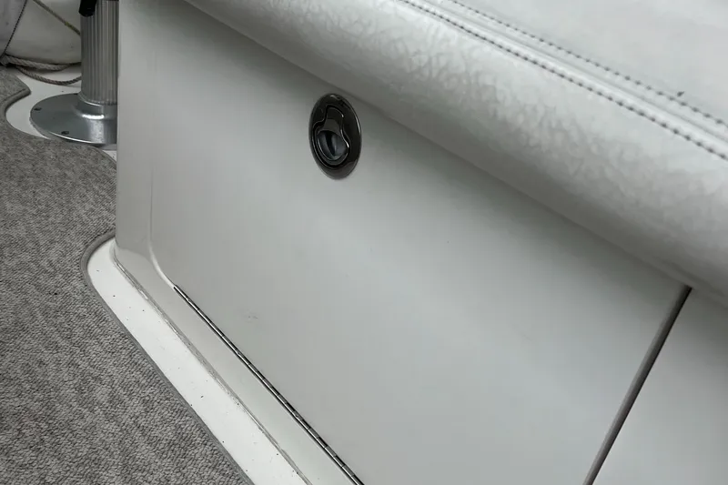 Slide: The Image of Interior detail of a 2000 Sea Ray 340 Sundancer boat, featuring seating and storage. - 43