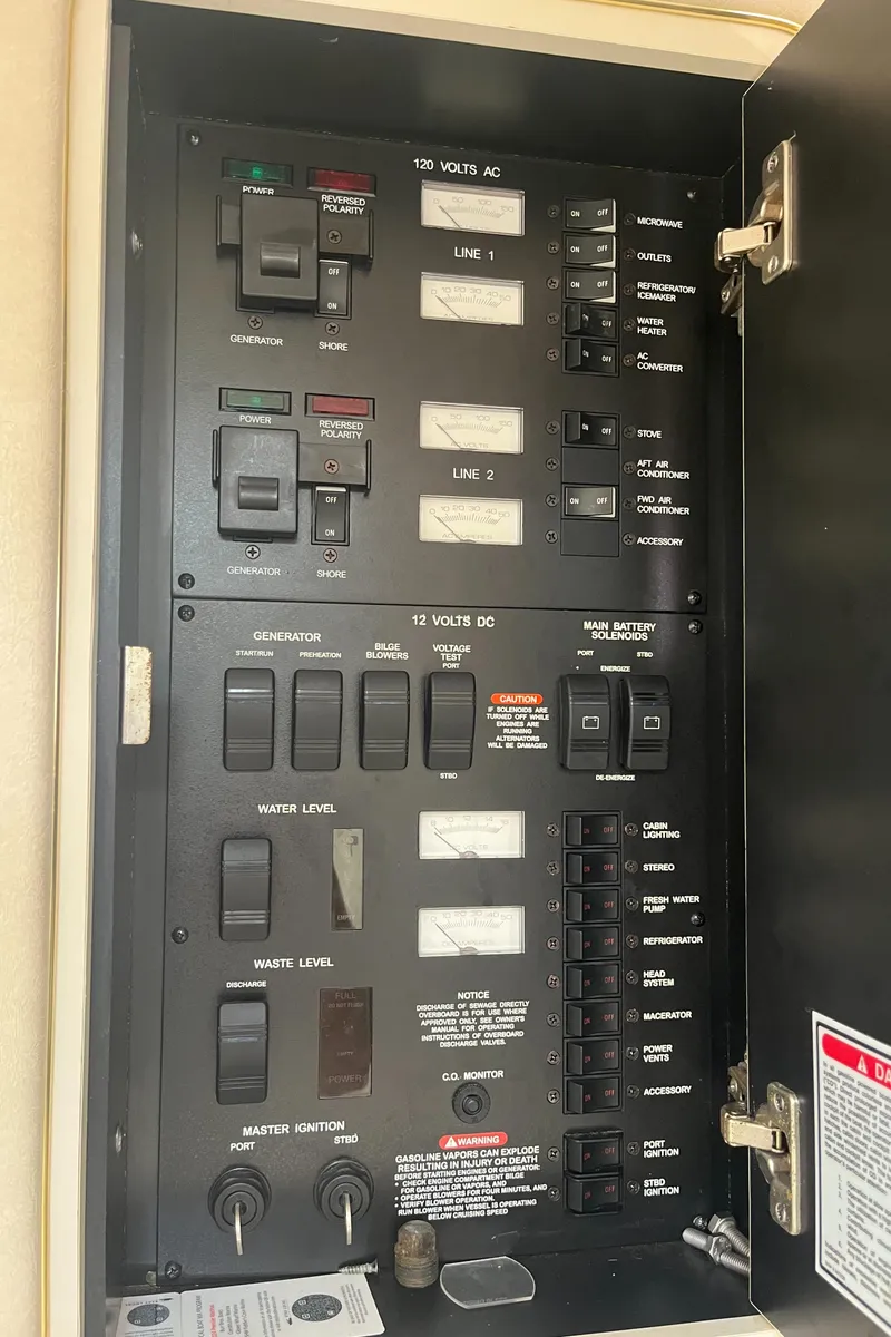 Slide: The Image of Electrical control panel on a 2000 Sea Ray 340 Sundancer boat. - 48