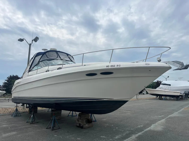 Slide: The Image of 2000 Sea Ray 340 Sundancer yacht on stands, overcast sky background. - 8