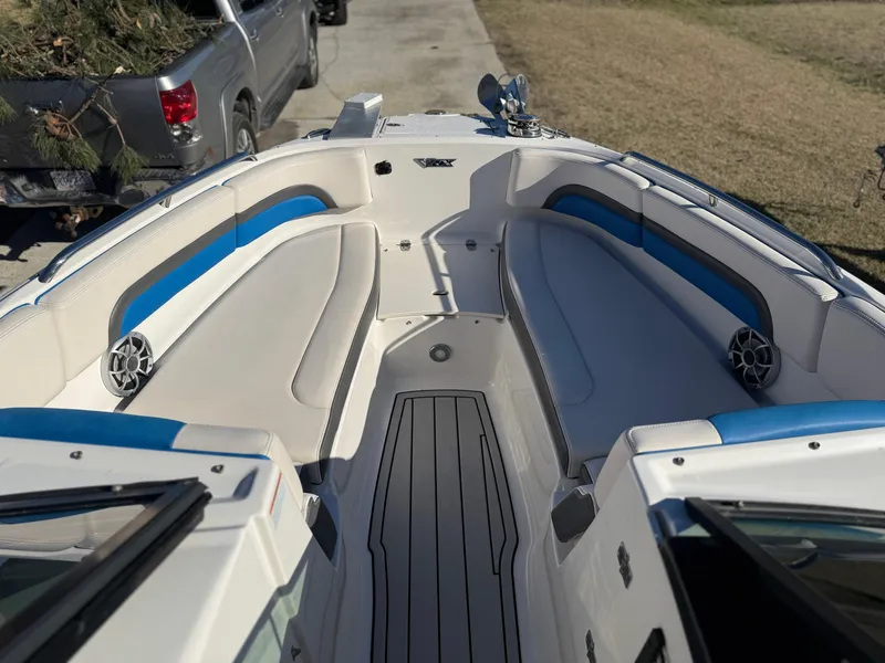 Slide: The Image of 2017 Chaparral Vortex 2430 VRX boat interior with blue and white seating. - 11