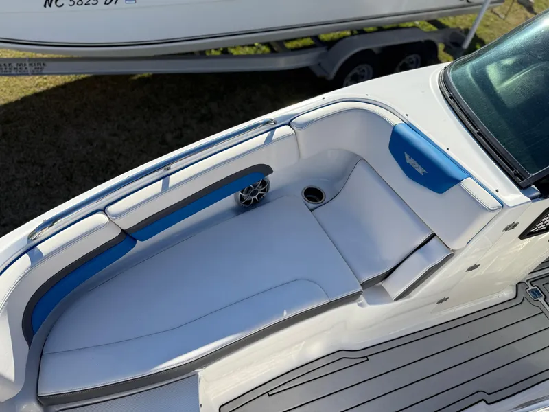Slide: The Image of 2017 Chaparral Vortex 2430 VRX boat interior with white and blue seating. - 12