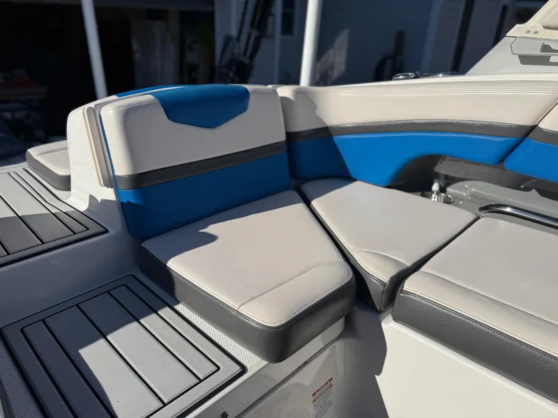 Slide: The Image of 2017 Chaparral Vortex 2430 VRX boat interior with blue and gray seating. - 13