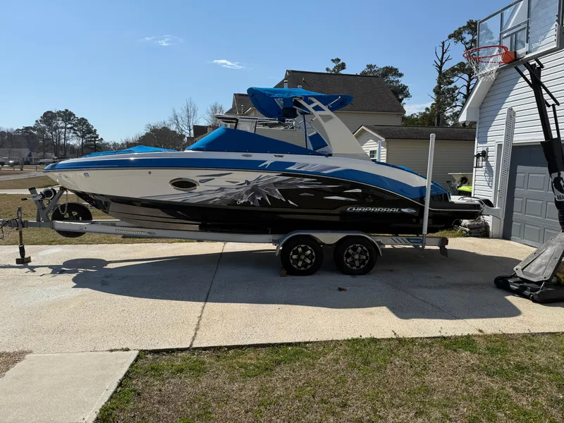 Slide: The Image of 2017 Chaparral Vortex 2430 VRX boat on trailer, parked in driveway. - 4