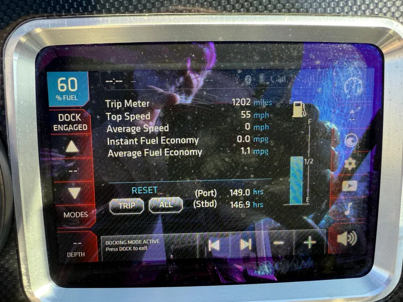 Slide: The Image of 2017 Chaparral Vortex 2430 VRX dashboard display showing trip data and fuel economy. - 8