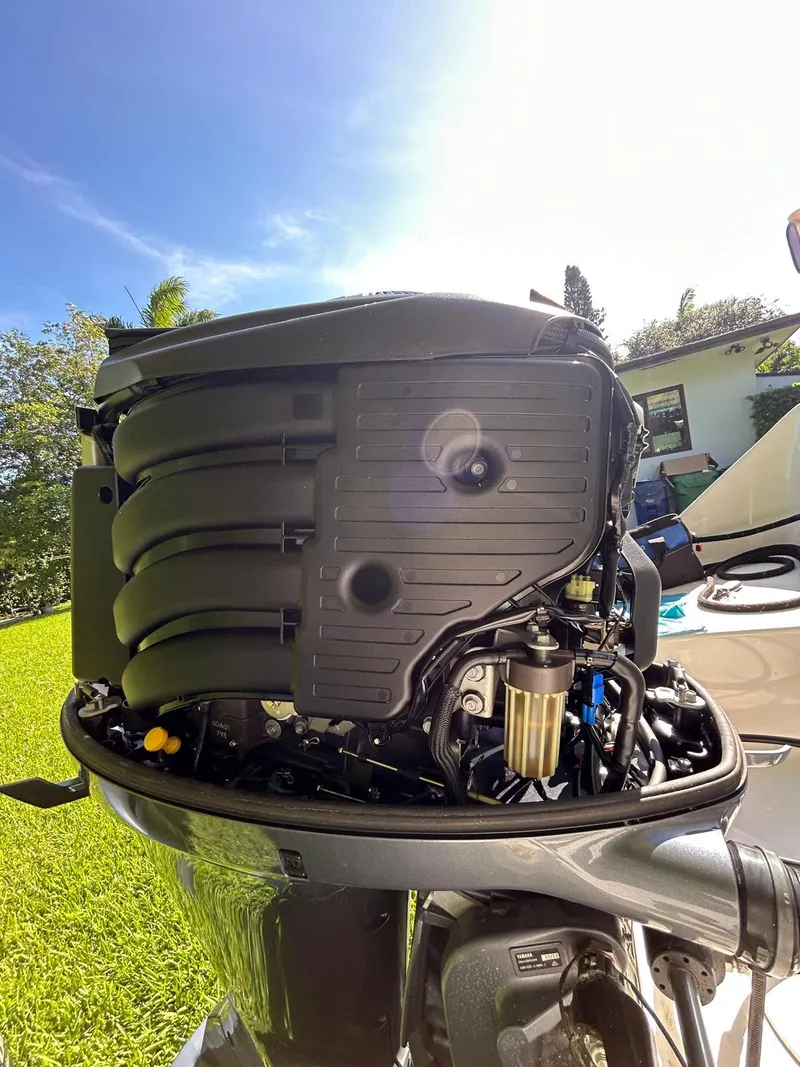 Slide: The Image of 2018 Robalo R222 outboard engine with open cover, showcasing internal components. - 14
