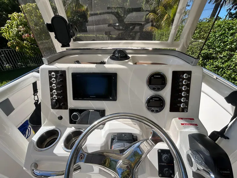 Slide: The Image of 2018 Robalo R222 boat dashboard with Garmin display and Yamaha controls. - 7