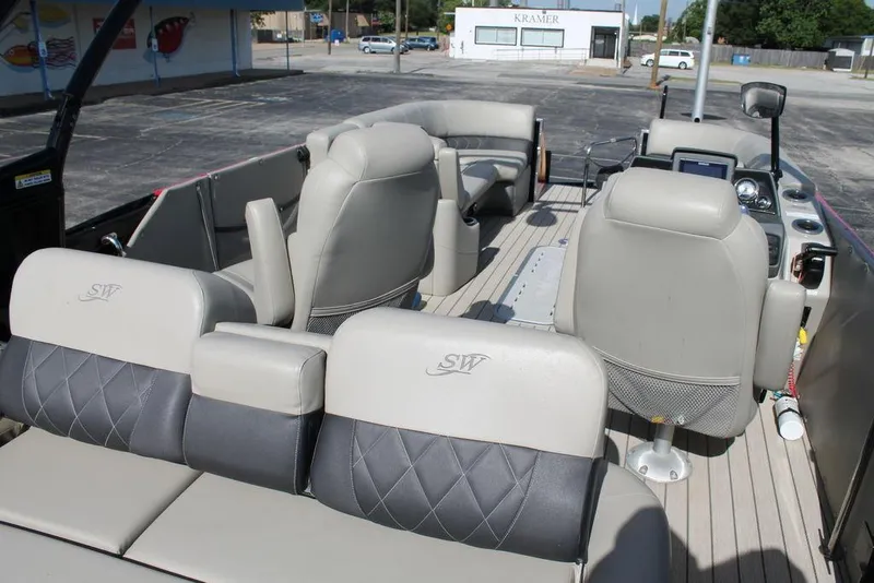 Slide: The Image of Interior of a 2021 Silver Wave 2410 SW5 JS pontoon boat with luxurious seating. - 10